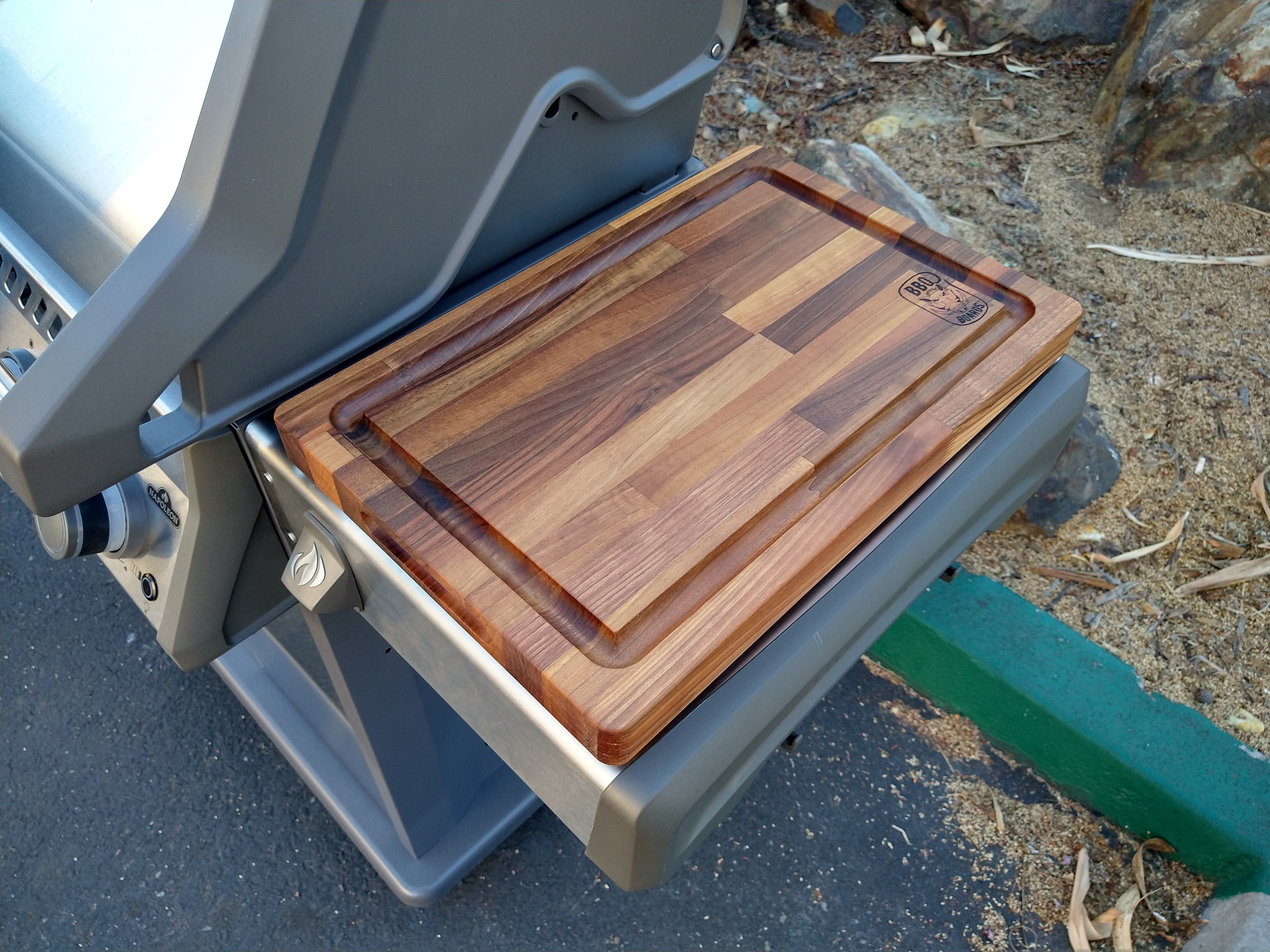 Wooden cutting board on a portable stand outdoors