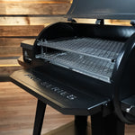 Black barbecue grill on a wooden floor